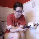 A Canadian girl wearing glasses tells us that her period is about over and how she deals with it. She sings to herself and farts a few times, but there are no really noticeable pooping sounds. Presented in 720P HD. 8 minutes.